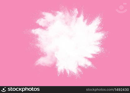 White powder explosion on pink background. Paint Holi.