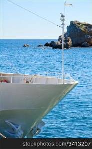 White prow of excursion tourist yacht and sea water surface behind