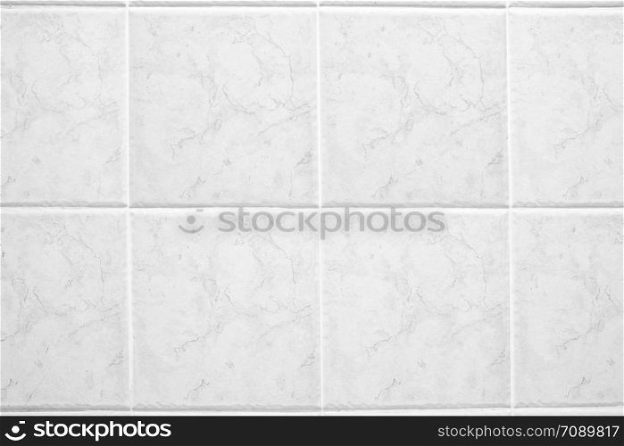 White quadrate marble tiles in the bathroom.