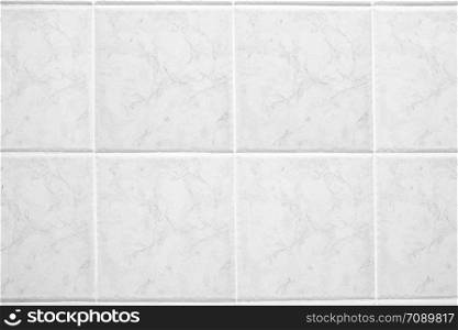 White quadrate marble tiles in the bathroom.