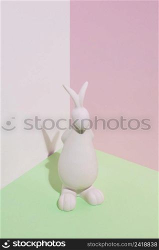 white rabbit figurine green table