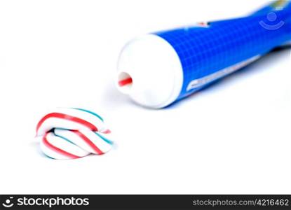 white red and blue squeezed toothpaste isolated on a white background
