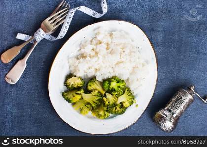 white rice and broccoli . boiled white rice and broccoli on plate, diet food,stock photo