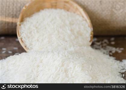 white rice grains. white rice grains on wooden table