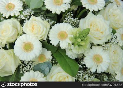 White roses and white gerberas in a wedding arrangement