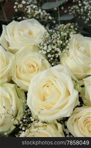 White roses, mixed with green in a bridal bouquet