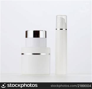 white round plastic jar and bottle for cosmetic products. Blank for branding products, mock up