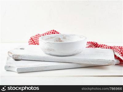 white round wooden plate and cutting board, close up