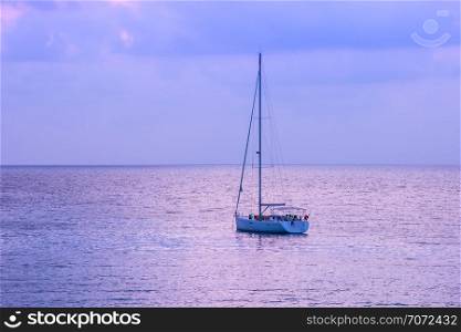 White sailboat of tourist at the background with twilight sky on the Ao thai sea area around haad bangbao of koh kood in trat province.Thailand.