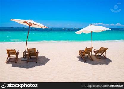 White sand beach with umbrellas and chairs, Boracay island, Philippines