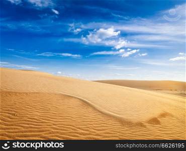 White sand dunes in desert on sunrise, Mui Ne, Vietnam.. Desert sand dunes on sunrise