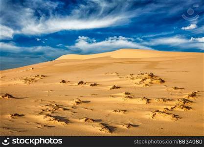 White sand dunes in desert on sunrise, Mui Ne, Vietnam.. Desert sand dunes on sunrise