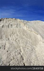 white sand mound quarry like a moon landscape