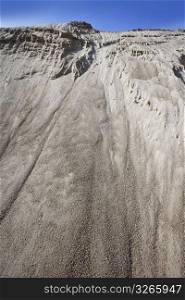 white sand quarry mound like moon mountain blue sky