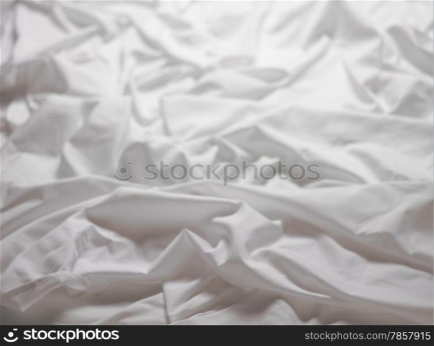 White satin sheets with a ripple - background image