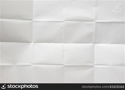 white sheet of paper folded into 16 pieces