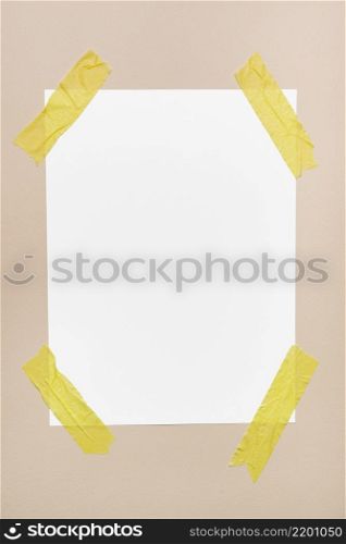 white sheet stick wall with yellow tape