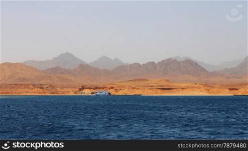 White Ship Moving By The Red Sea