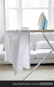 White shirt on ironing board in living room