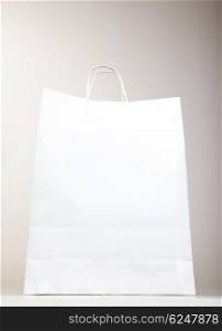 White Shopping Bag over gray background, studio shot