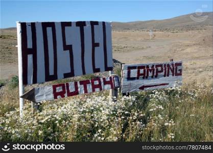 White signs of hostel and camping on the road 40 in Patagonia, Argentina