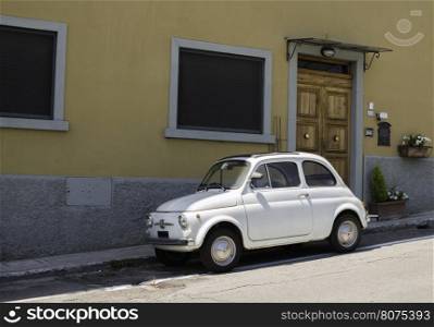 White small vintage Fiat Abarth. Sin light