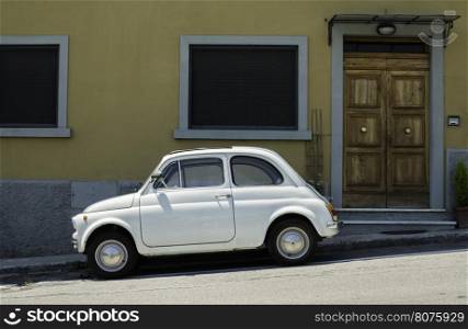 White small vintage Fiat Abarth. Sin light
