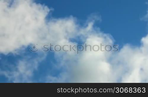 white smoke against a blue sky