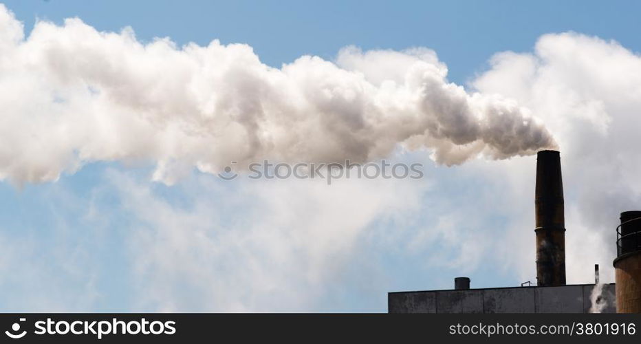 White smoke billows out of industrial stack day in and day out