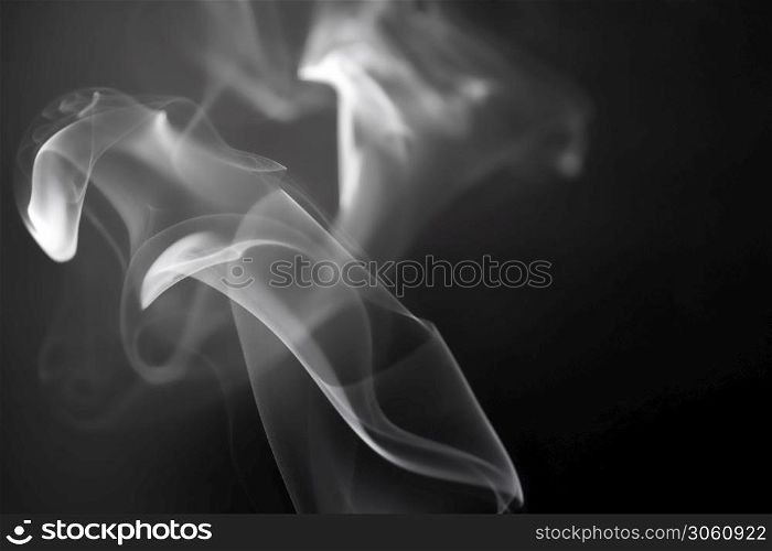 white smoke on a dark background