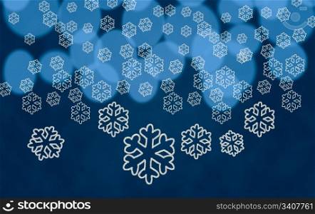 White snowflake shapes dropping in front of blue out of focus christmas tree lights