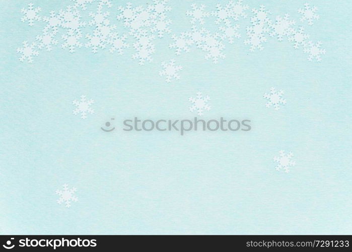 White snowflakes over a turquoise background                               