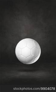White soccer ball isolated on a black studio background. 3D illustration. White soccer ball on a black studio background