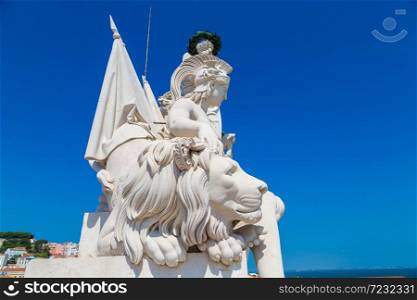 White statue above Praca do Comercio (Commerce square) in Lisbon in a beautiful summer day, Portugal