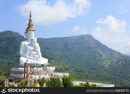 white statue of Buddha with blue sky in the temple