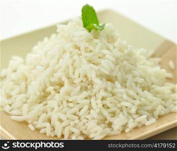 White steamed rice in a dish close up
