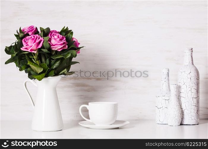 White still life with roses and cup. White still life
