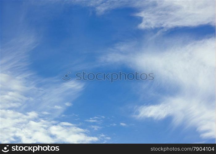 White stratospheric clouds on blue sky background