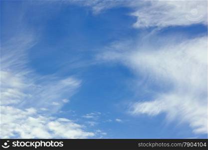 White stratospheric clouds on blue sky background