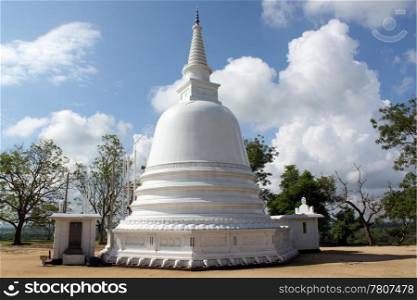 White stupa and clouds in monastery near Ampara, Sri Lanka