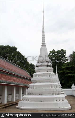 White stupa in the yard of Wat Saket Ratcha Wora Maha Wihan