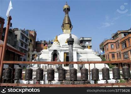 White stupa near building in Patan, Nepal