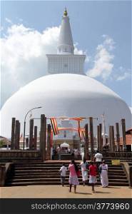 White stupa Ruwanwelisaya Chedi and people in Anuradhapura, Sri Lanka