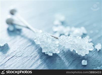 White sugar crystals on the gray board