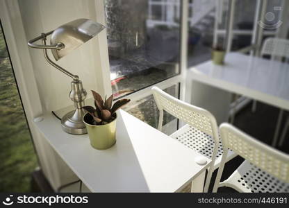 White table and chair in cargo container living room, stock photo