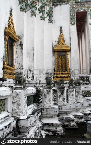 White temple with golden windows in wat Pho, Bangkok, Thailand