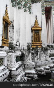 White temple with golden windows in wat Pho, Bangkok, Thailand