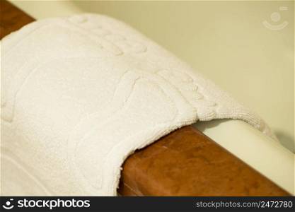 white terry towel in the hotel bathroom. towel in the bathroom