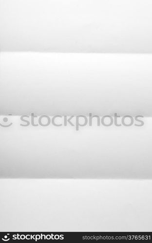 white textured sheet of paper folded in four