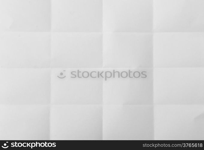 white textured sheet of paper folded in sixteen